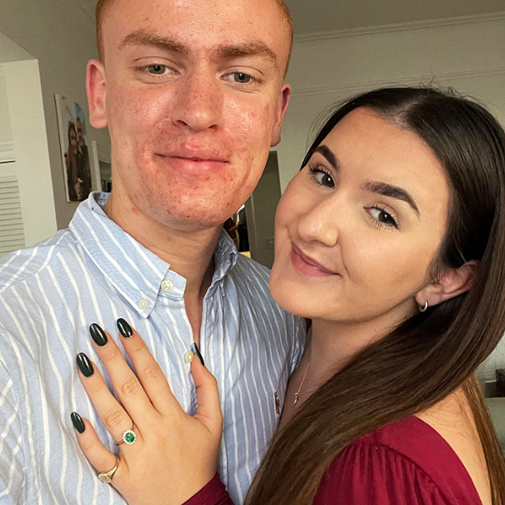 Engaged couple wearing Emerald oval cut Star Platinum engagement ring from Fenton | Matthew & Madison's Fenton Love Story